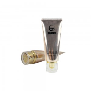 High-end 100ML Custom Golden Stamping Facial Cleaner PE Glossy Straight Grain Sealing Packaging Tube With Acrylic Cap
